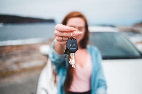 Woman offering a set of car keys