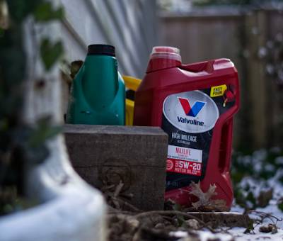 Oil container sitting on the ground